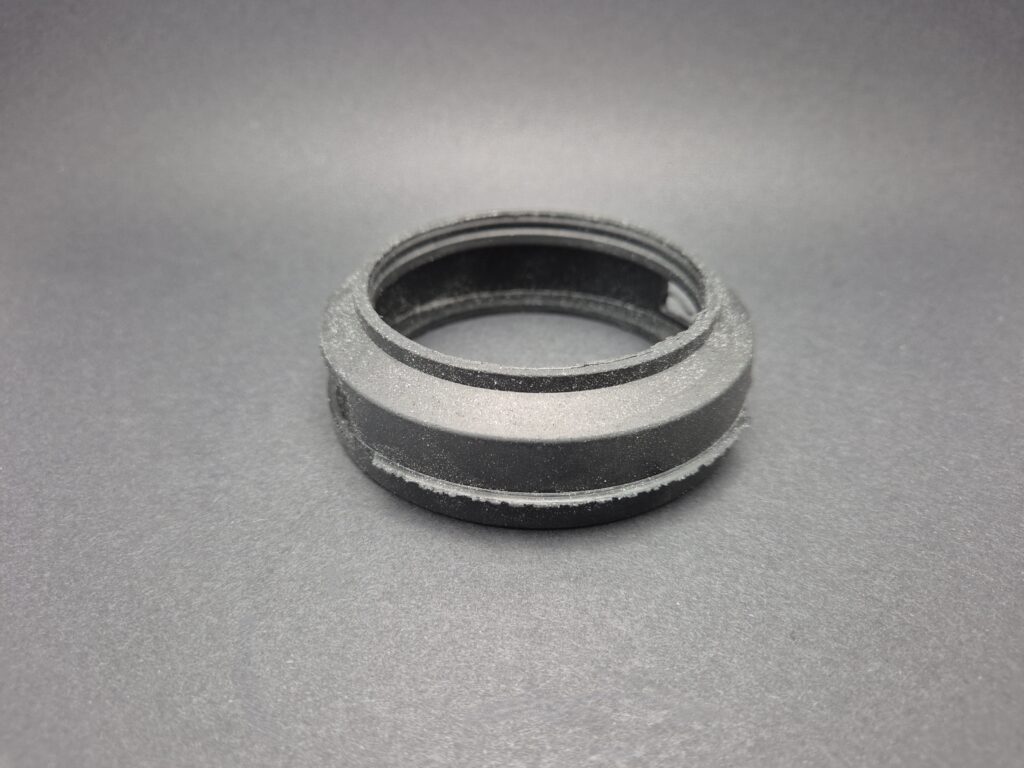 Representation of a rubber moulded part removed too early from the cryogenic de-burring machine.